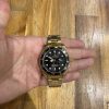 Rolex Submariner Date en oro amarillo de 18 quilates con bisel y esfera negros. (2)