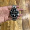 Rolex Submariner en acero Oystersteel con bisel negro y esfera negra.